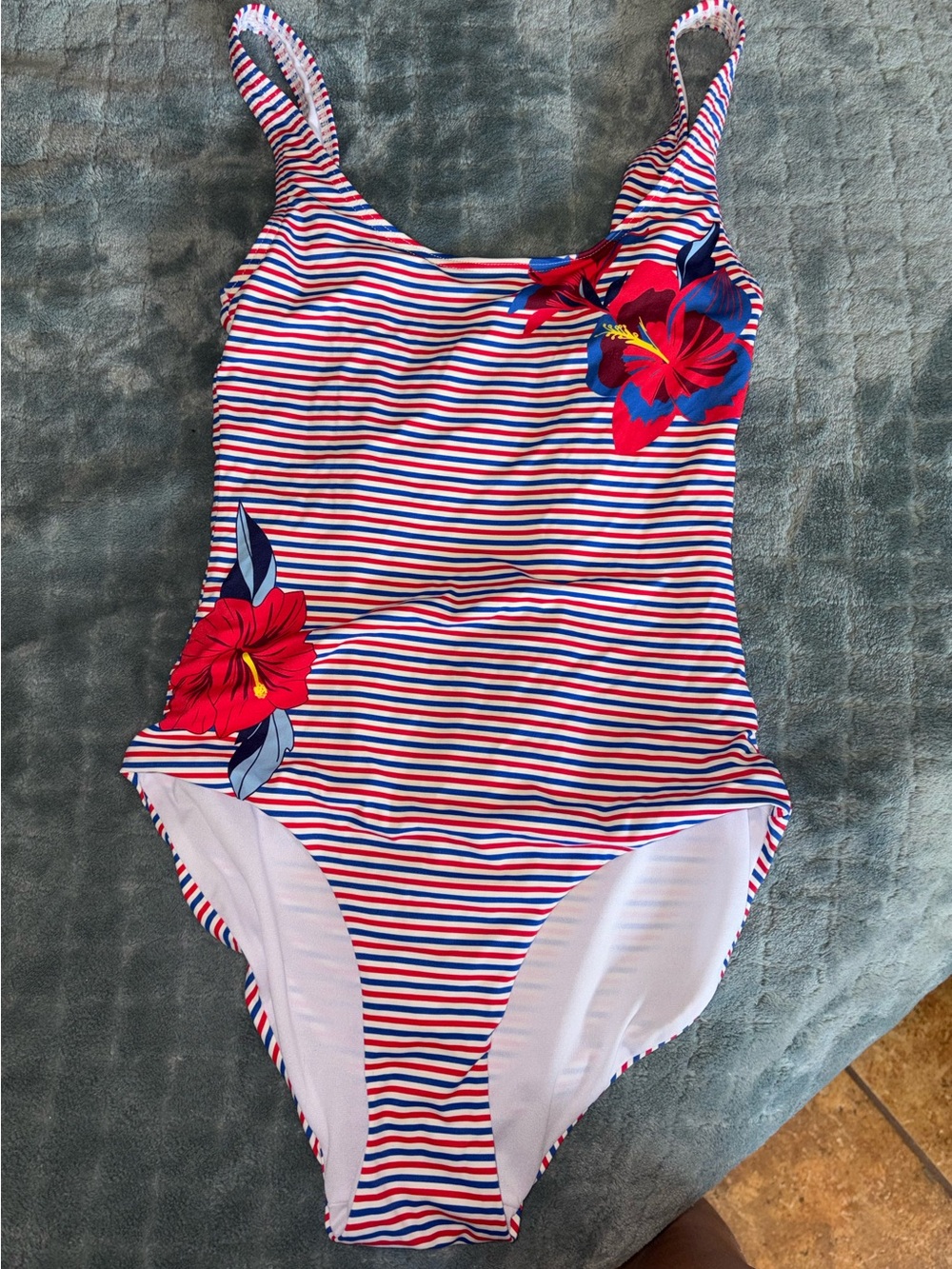 Striped One-Piece Swimsuit with Red Floral Accent